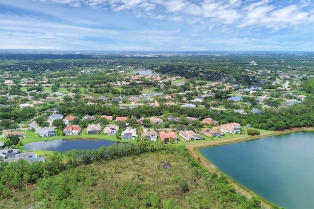 drone / aerial view with a water view