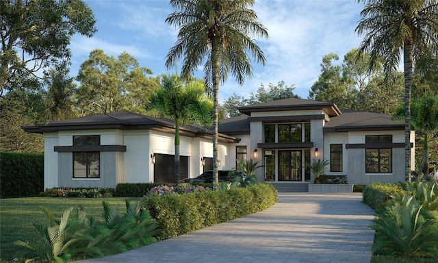 view of front facade with a garage and a front lawn