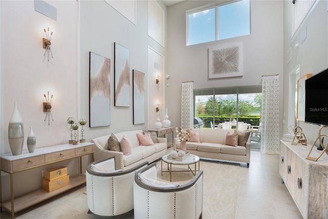 15165 Shady Palms Ln, Nokomis, FL 34275 - living room featuring a towering ceiling and light tile patterned flooring