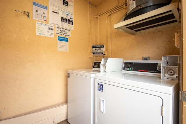 clothes washing area featuring washing machine and clothes dryer