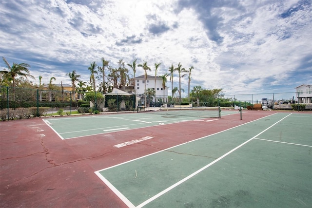 view of tennis court featuring basketball court