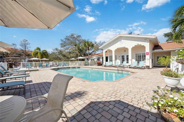 4260 Central Sarasota Pkwy Unit 213, Sarasota, FL 34238 - community pool featuring a patio and french doors