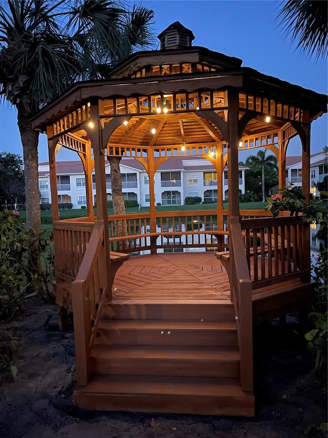 deck at dusk with a gazebo