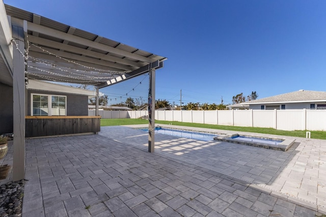 view of swimming pool with a patio and a hot tub