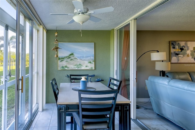 dining room with a textured ceiling and ceiling fan