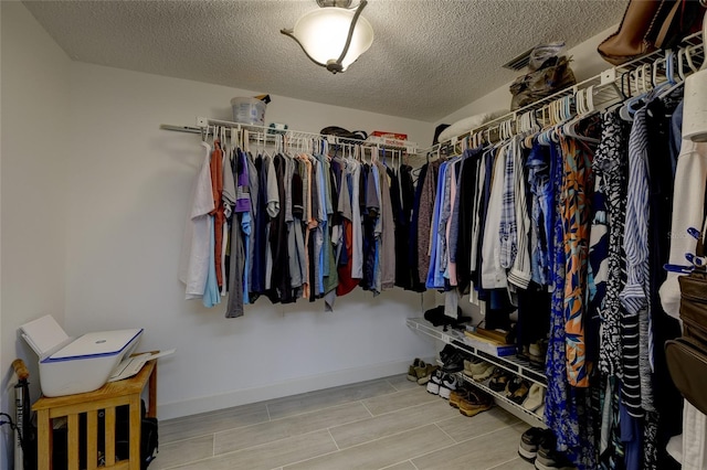 4550 Pinebrook Cir Unit 103, Bradenton, FL 34209 - walk in closet with wood finish floors