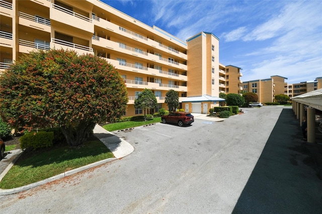 4550 Pinebrook Cir Unit 103, Bradenton, FL 34209 - view of building exterior featuring uncovered parking