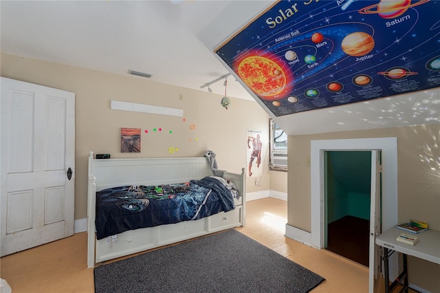 bedroom with lofted ceiling