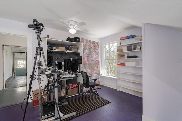 interior space featuring dark wood-type flooring and ceiling fan