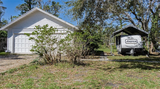 exterior space featuring an outbuilding and a garage