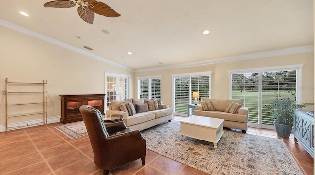 living room with crown molding, ceiling fan, lofted ceiling, and tile patterned flooring