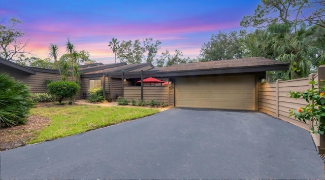 single story home featuring a garage