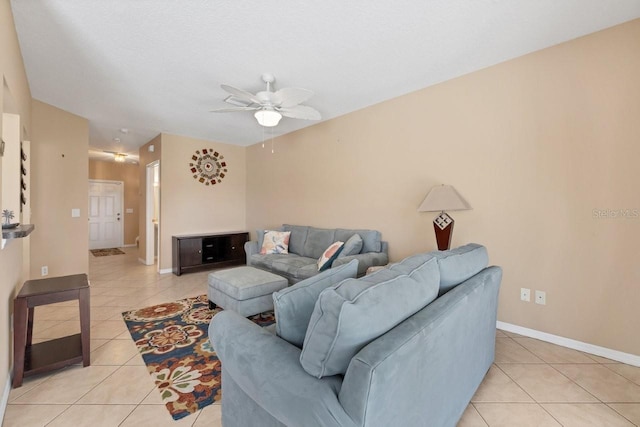 tiled living room with ceiling fan