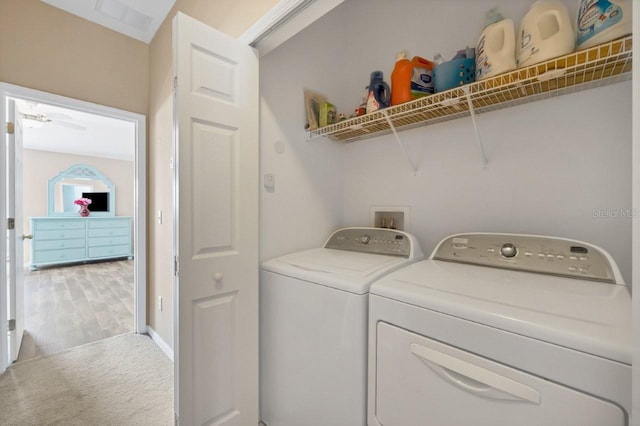 laundry room with carpet flooring and washer and clothes dryer