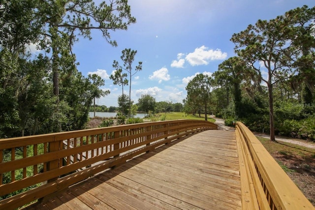 view of home's community featuring a deck with water view