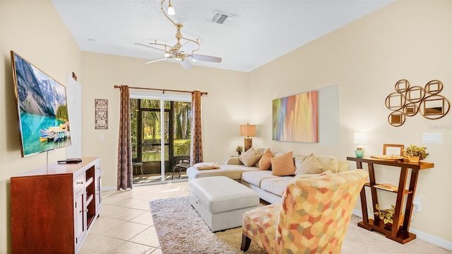 tiled living room featuring ceiling fan