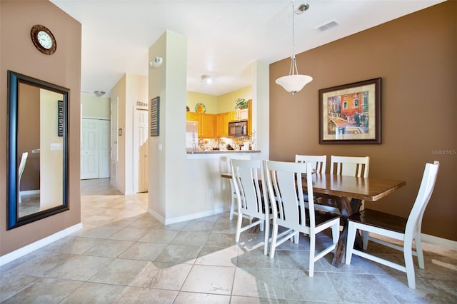 view of tiled dining area