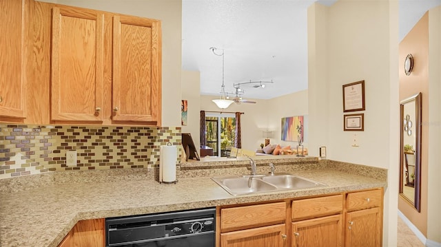 kitchen with black dishwasher, tasteful backsplash, sink, kitchen peninsula, and track lighting