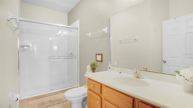 bathroom featuring vanity, toilet, walk in shower, and tile patterned flooring