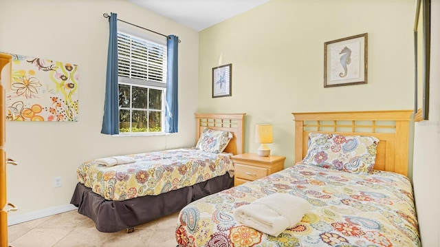 bedroom with light tile patterned floors