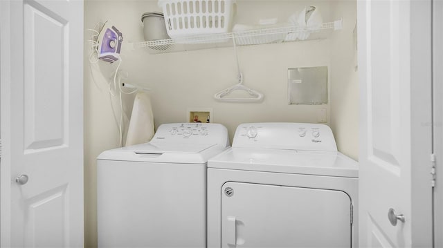 washroom with independent washer and dryer