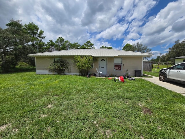 ranch-style home with a front lawn