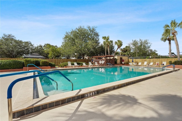 view of swimming pool with a patio