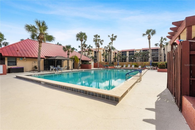 view of swimming pool featuring a patio