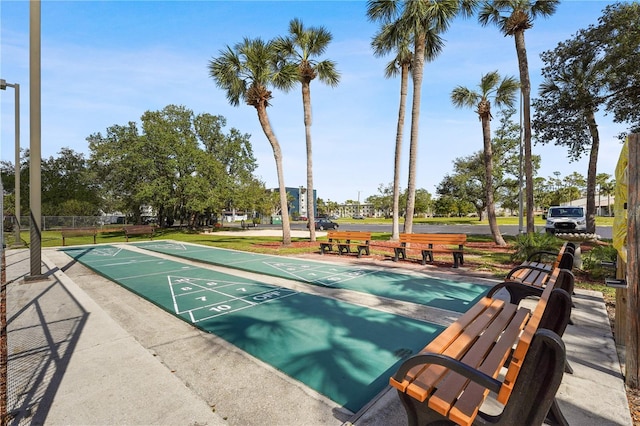 view of property's community featuring shuffleboard