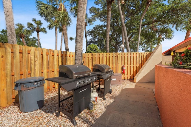 view of patio with fence and grilling area