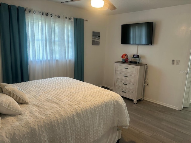 bedroom featuring wood-type flooring and ceiling fan