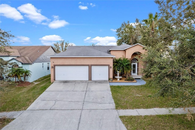 view of front facade featuring a front lawn and a garage