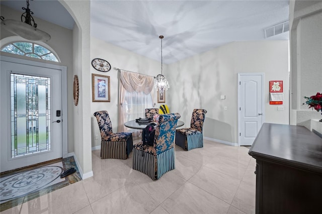 entryway with a notable chandelier