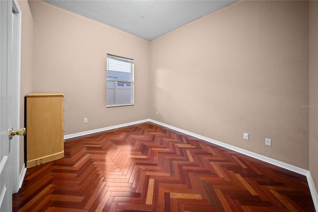 empty room featuring dark parquet floors