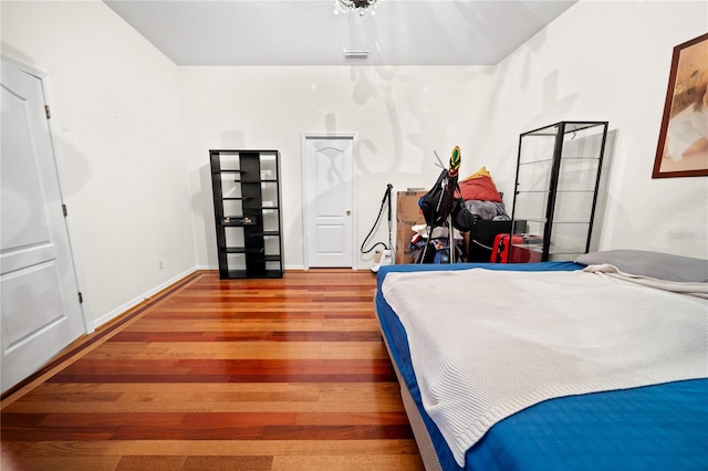 bedroom featuring wood-type flooring