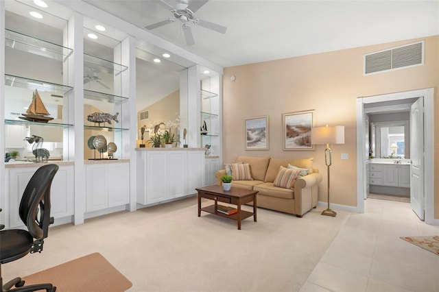 living room featuring ceiling fan and light carpet