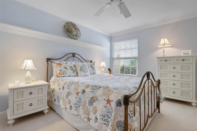 bedroom featuring light carpet, ceiling fan, and crown molding