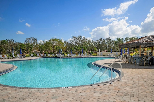 view of swimming pool with a patio and a gazebo