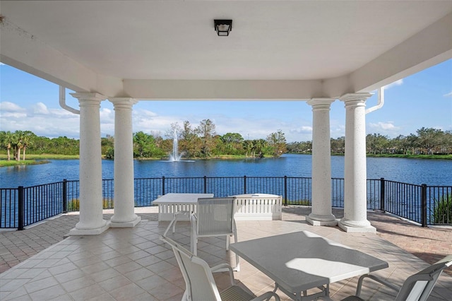 view of patio with a water view