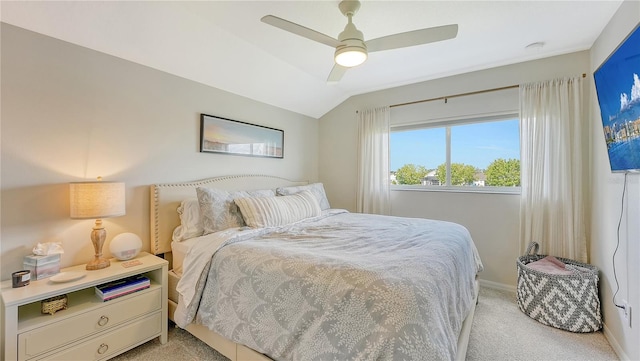 carpeted bedroom featuring vaulted ceiling and ceiling fan