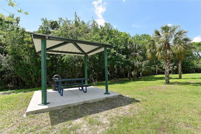 view of community with a gazebo, a yard, and a patio area