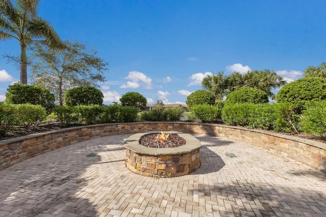 view of patio with an outdoor fire pit