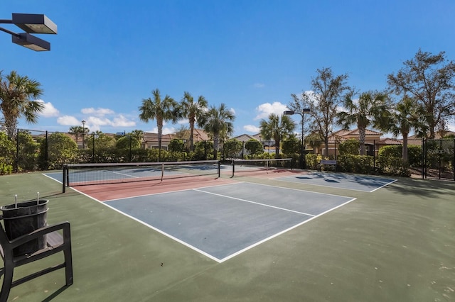 view of sport court featuring basketball hoop