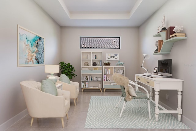 tiled office space featuring a tray ceiling