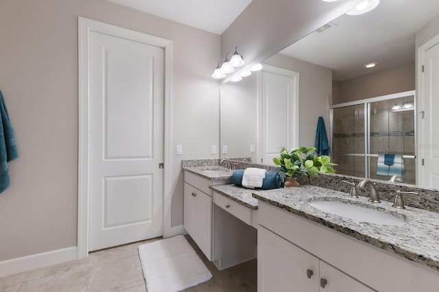 bathroom featuring tile patterned flooring, vanity, and an enclosed shower