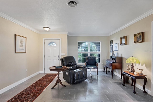 living area featuring ornamental molding and a textured ceiling