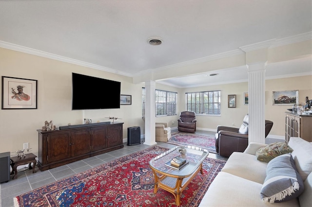 living room featuring crown molding, decorative columns, and light tile patterned flooring