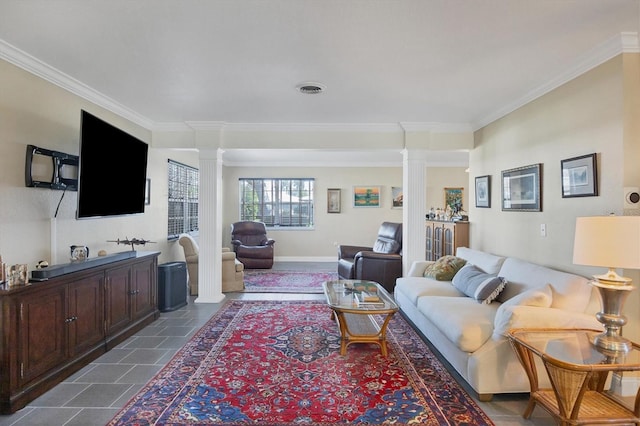 living room featuring crown molding and ornate columns