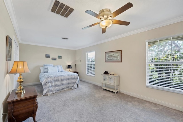 carpeted bedroom featuring multiple windows, crown molding, and ceiling fan