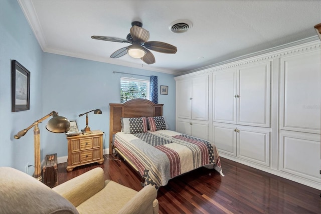 bedroom featuring a closet, ceiling fan, ornamental molding, and dark hardwood / wood-style flooring